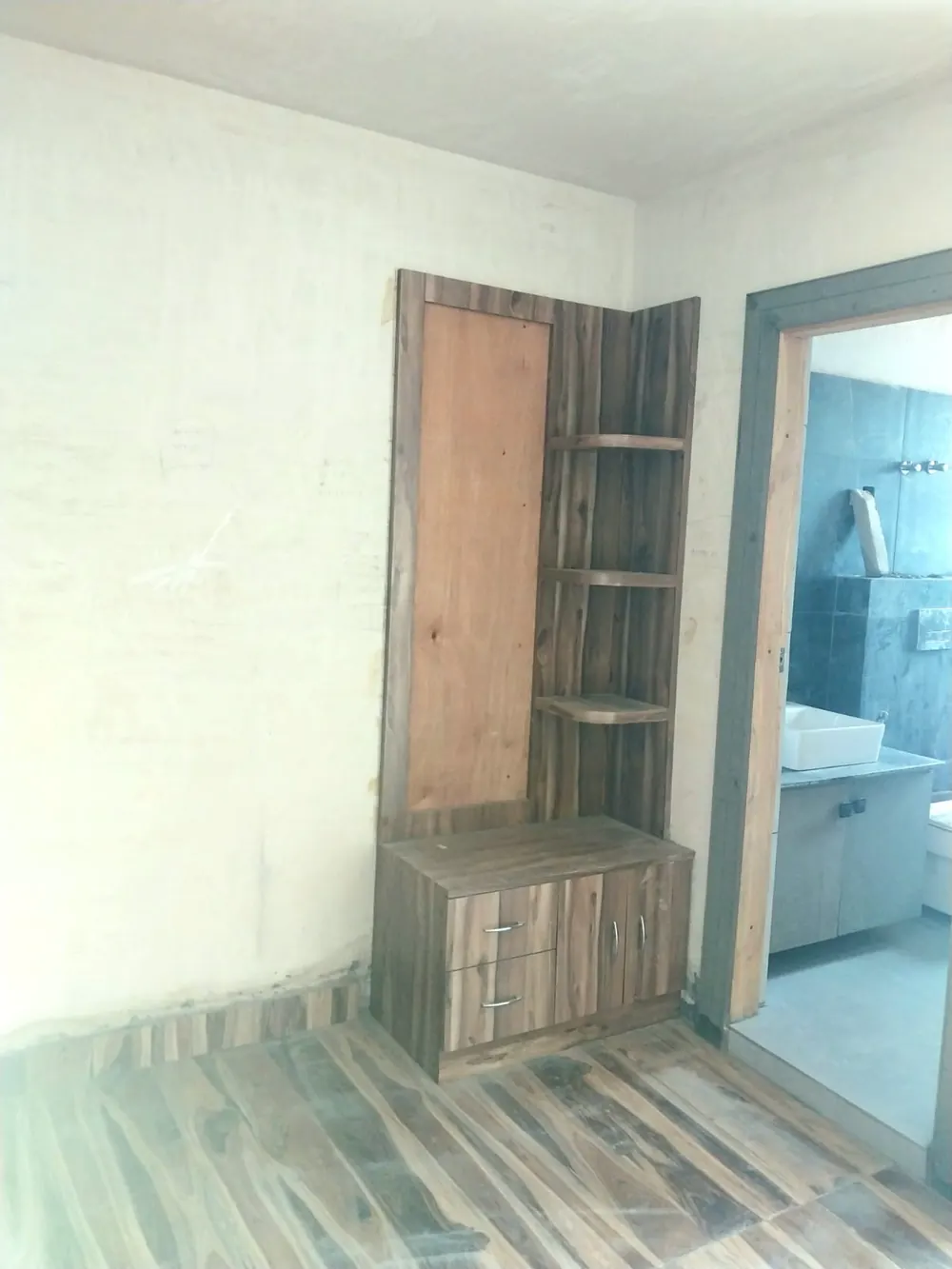 Wooden dresser unit beside the bathroom