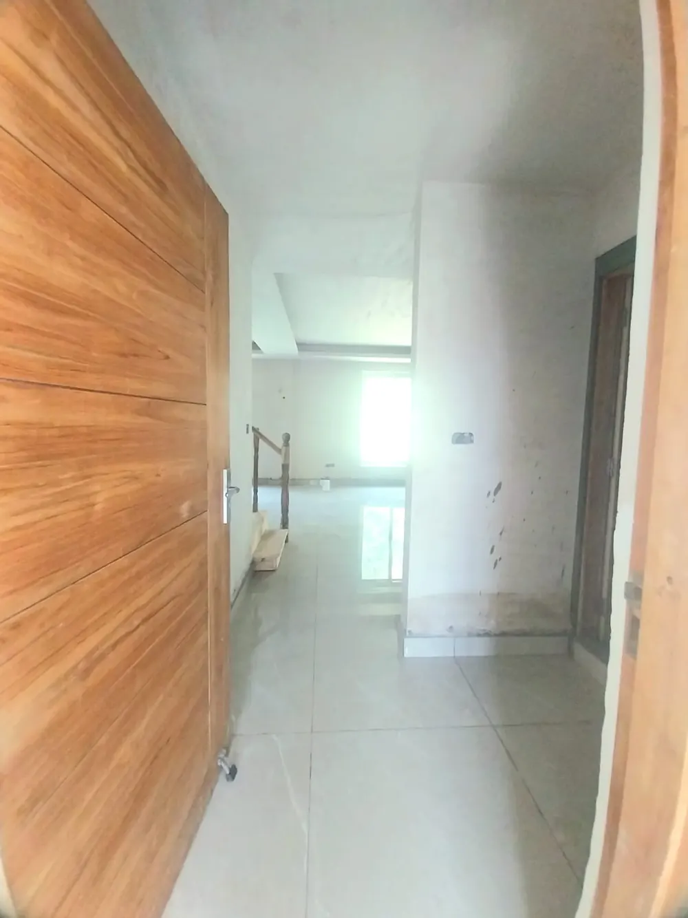 Entrance to the duplex with wooden door