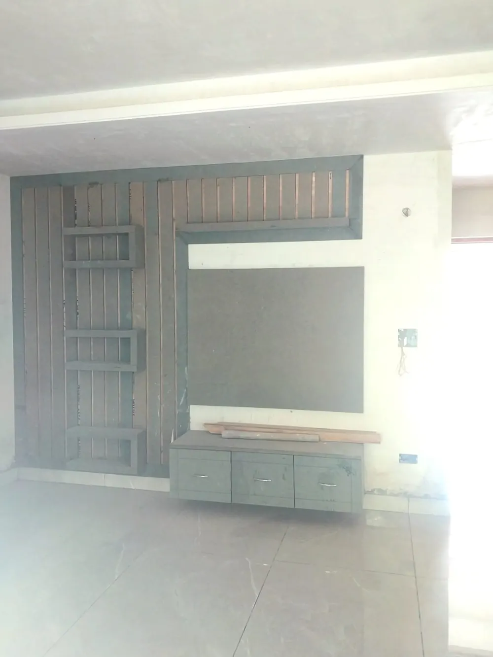 TV wall unit being installed